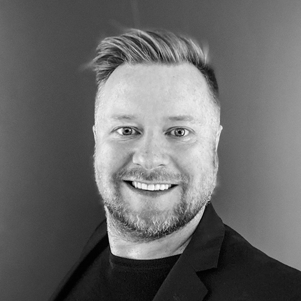 Black and white photo of Alex Counsell — monochrome headshot